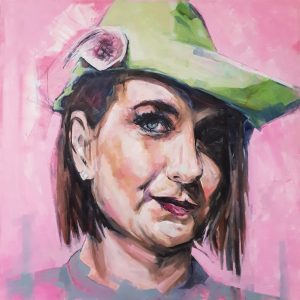 Striking portrait paining of a young lady wearing a green hat with pnk flower and shadow falling over her face