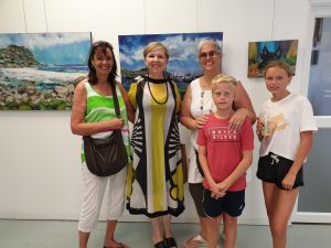 A group of ladies and chidren at Emma Jacobs Art exhibition